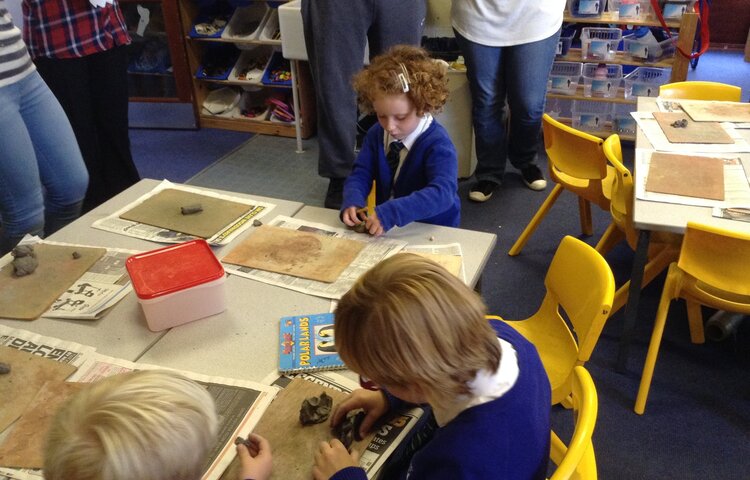 Image of Making clay penguins.