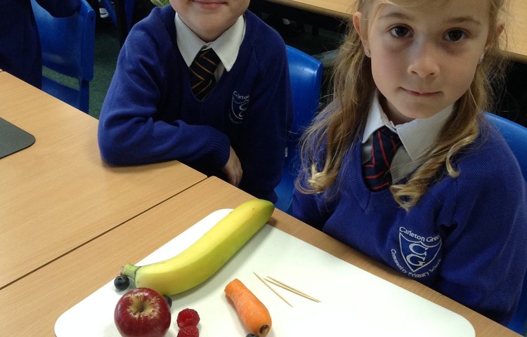 Image of Parrots' Class Made Fruit Kebabs Designed as Animals